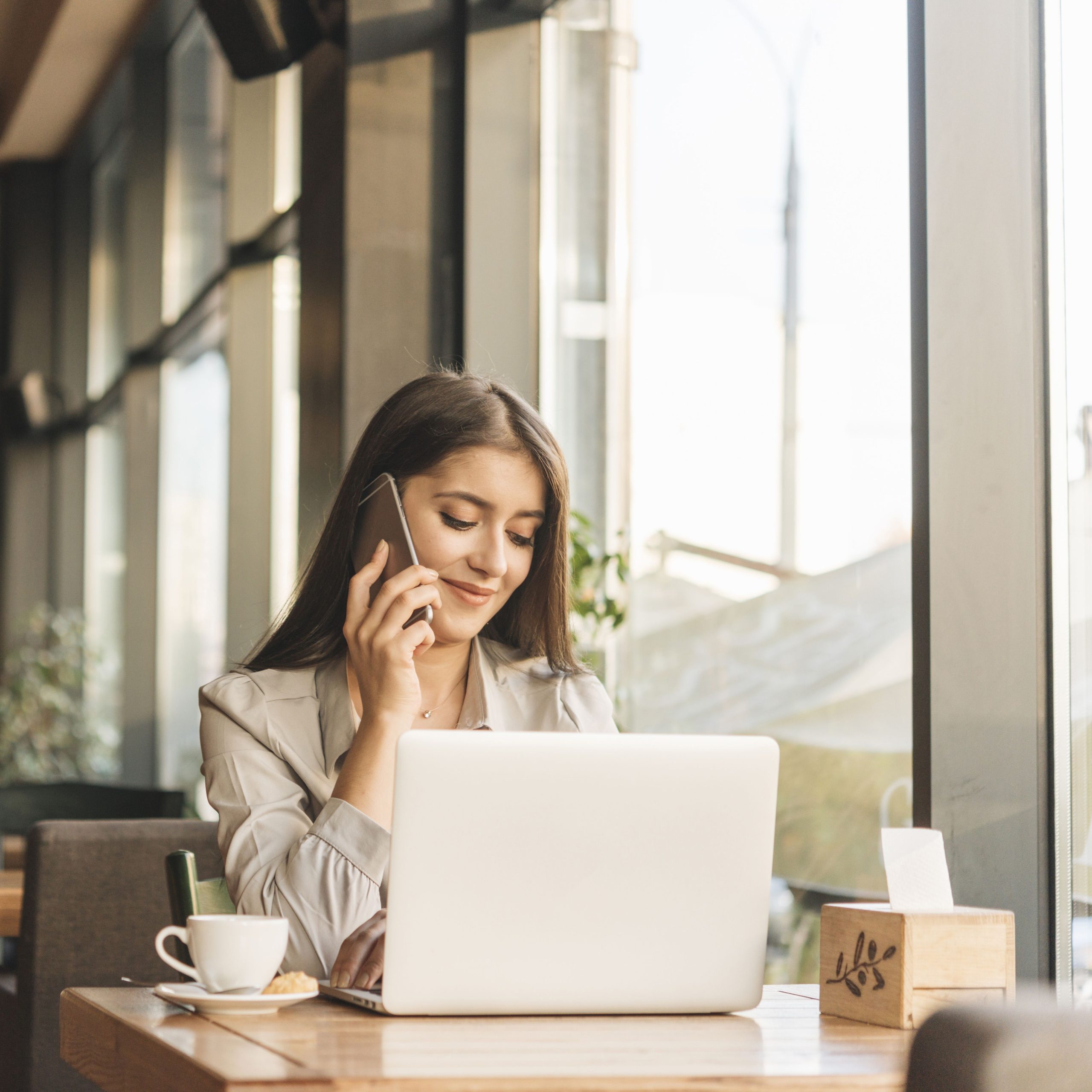 freelance-woman-working-with-laptop-coffee-shop